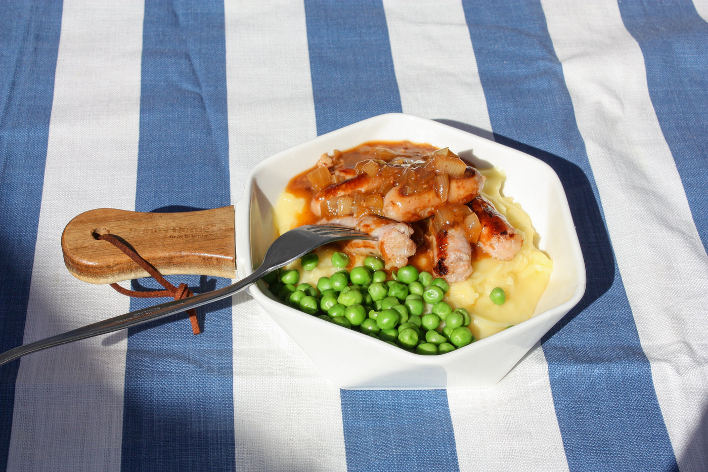 Kids Pork Sossies on Cheesy Mash with Peas and Gravy